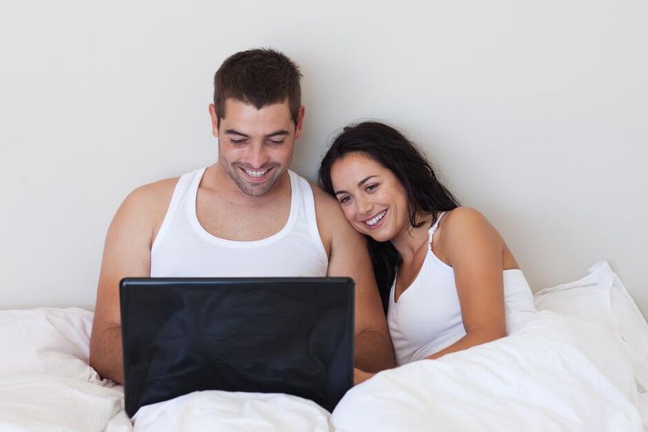 A young couple read a review about using external remedies for penis enlargement
